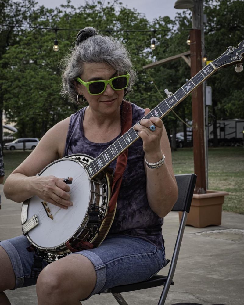 woman smiling playing banjo