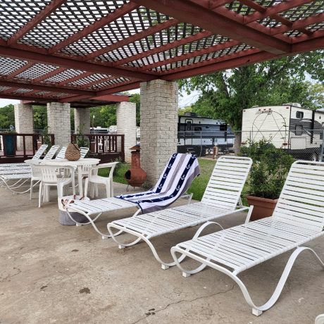 An inviting view of the resort's Olympic-sized swimming pool, emphasizing the relaxation and cooling off options available during hot Texas summers at Oakwood RV Resort in Fredericksburg, TX.