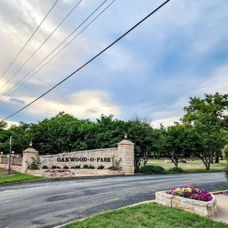 RV parked in spacious shady sites with full hookups and beautiful Texas views at Oakwood RV Resort in Fredericksburg, TX.