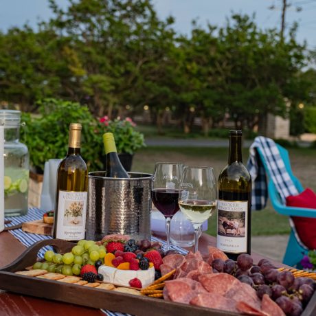 A delicious bite and wine at Oakwood RV Resort in Fredericksburg, TX, surrounded by beautiful shaded views and rustic charm.